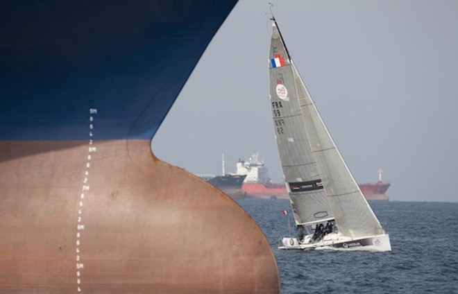 Courrier Dunkerque (FRA) navigate through container ships. Sailing Arabia the Tour 2012. Leg 5 from Dibba - Mussanah. Oman © Lloyd Images http://lloydimagesgallery.photoshelter.com/